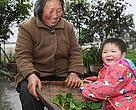 
People living happily in the Upper Yangtze region, where constructed wetlands are helping families recycle household wastewater. 